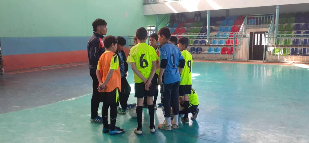 Children playing indoor soccer